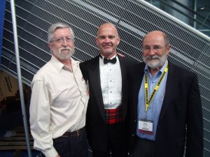 Garth Kirkham flanked by Mintec President John Davies (left) and Chairman Fred Banfield.