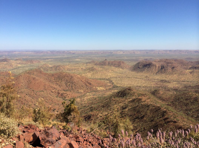 KMG’s Ridges Iron Ore Project consists of two gently dipping zones of sandstone hosted hematite mineralization called the Sam and Tony deposits located along the top of a high ridge line. This photo is taken from the top of the Sam Pit.